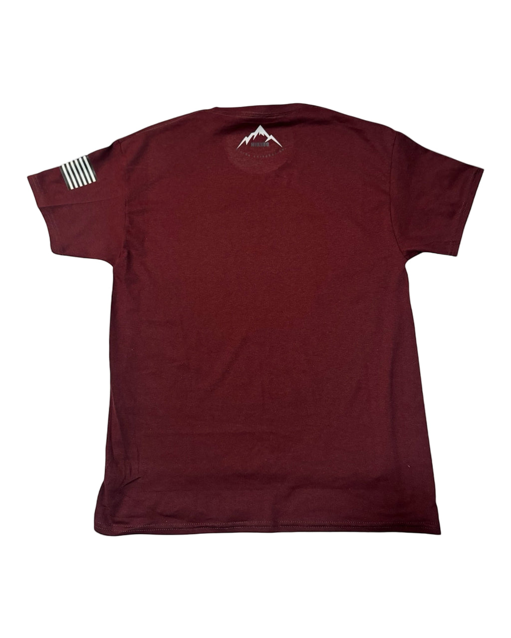 Maroon t-shirt with a mountain design on a gray background