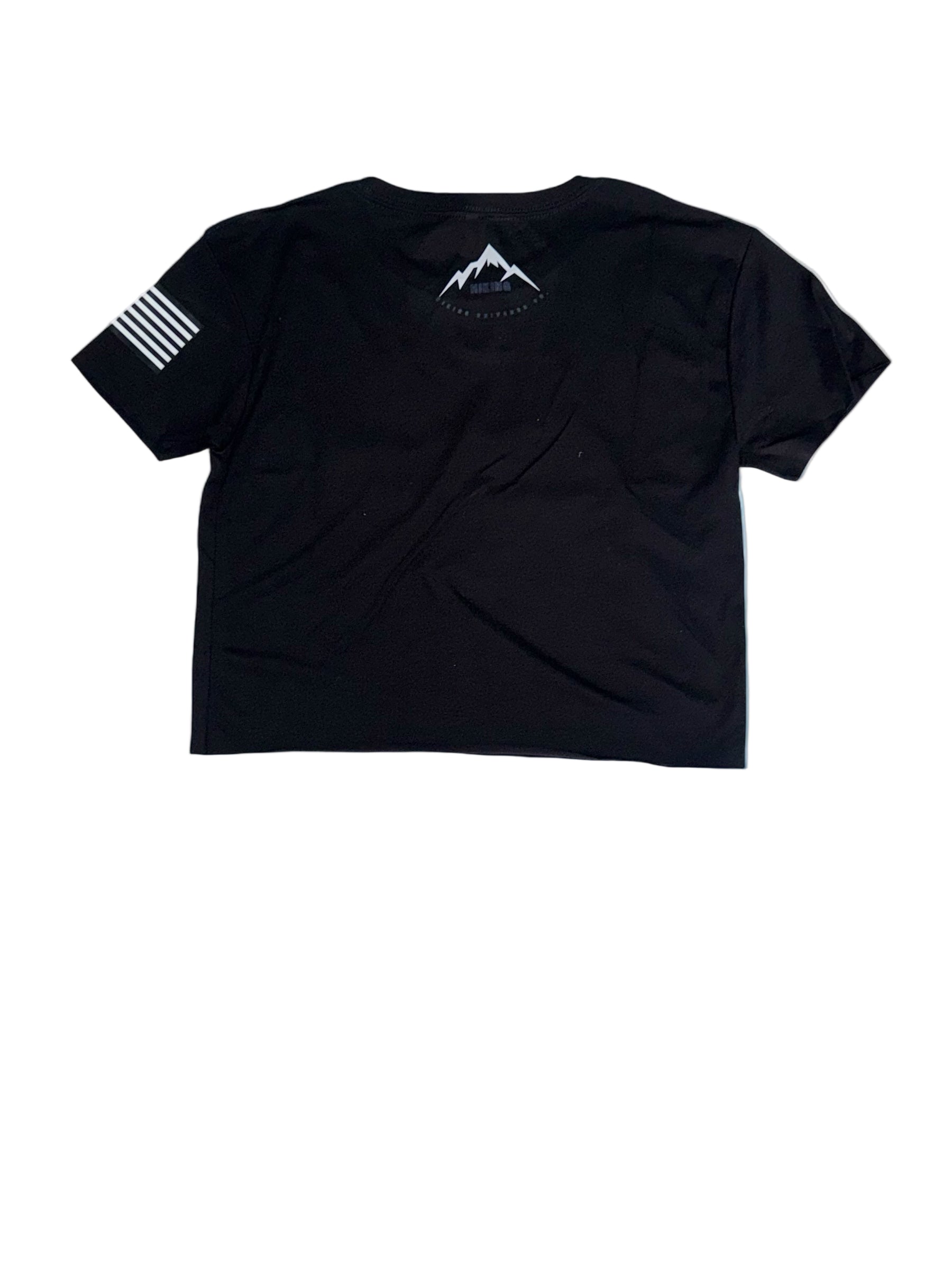 Black t-shirt with mountain design on a rocky cliff with mountain background