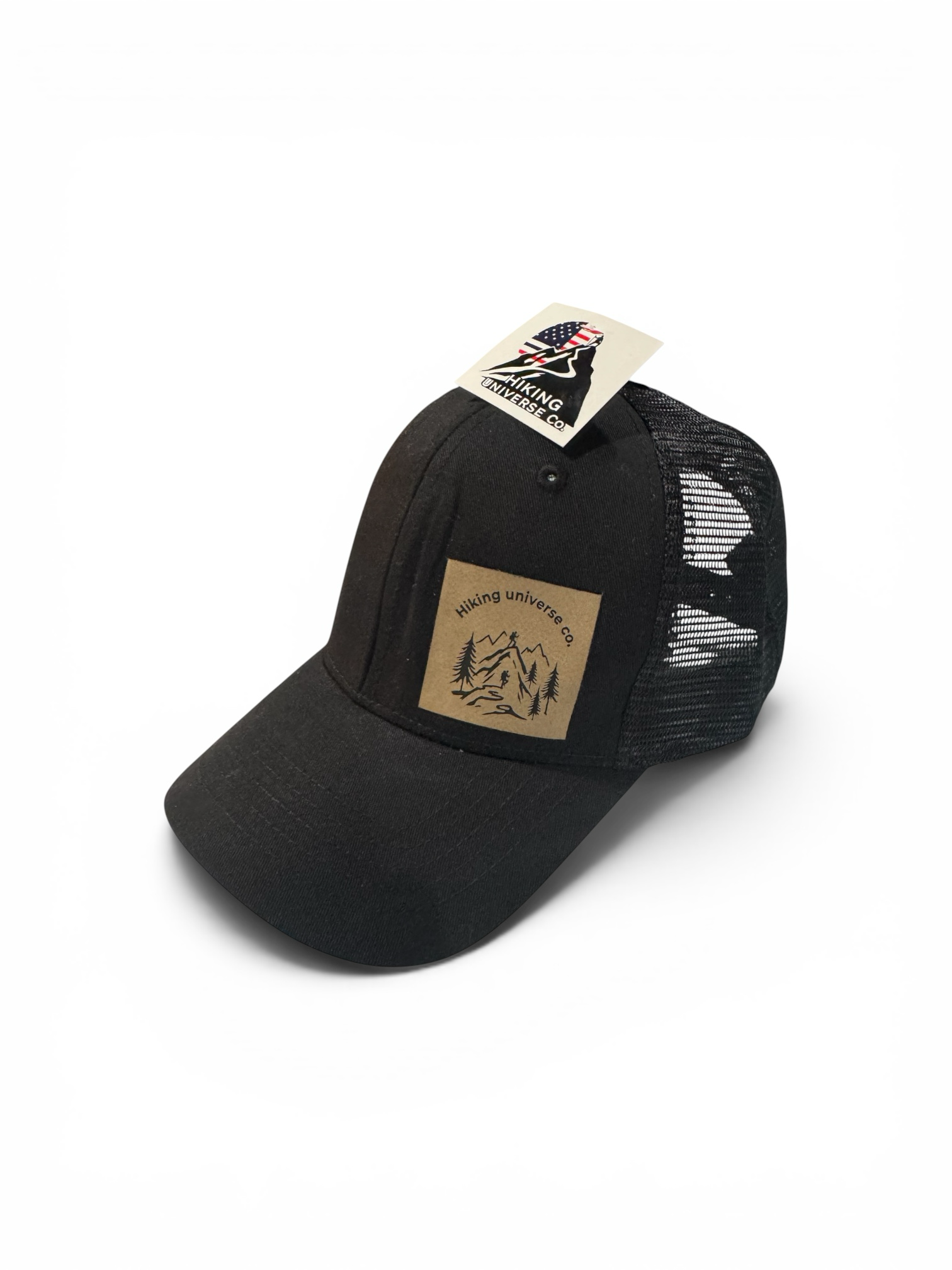 Hiking Universe Co. black trucker hat with mesh back and faux leather patch featuring mountain landscape debossed logo.
