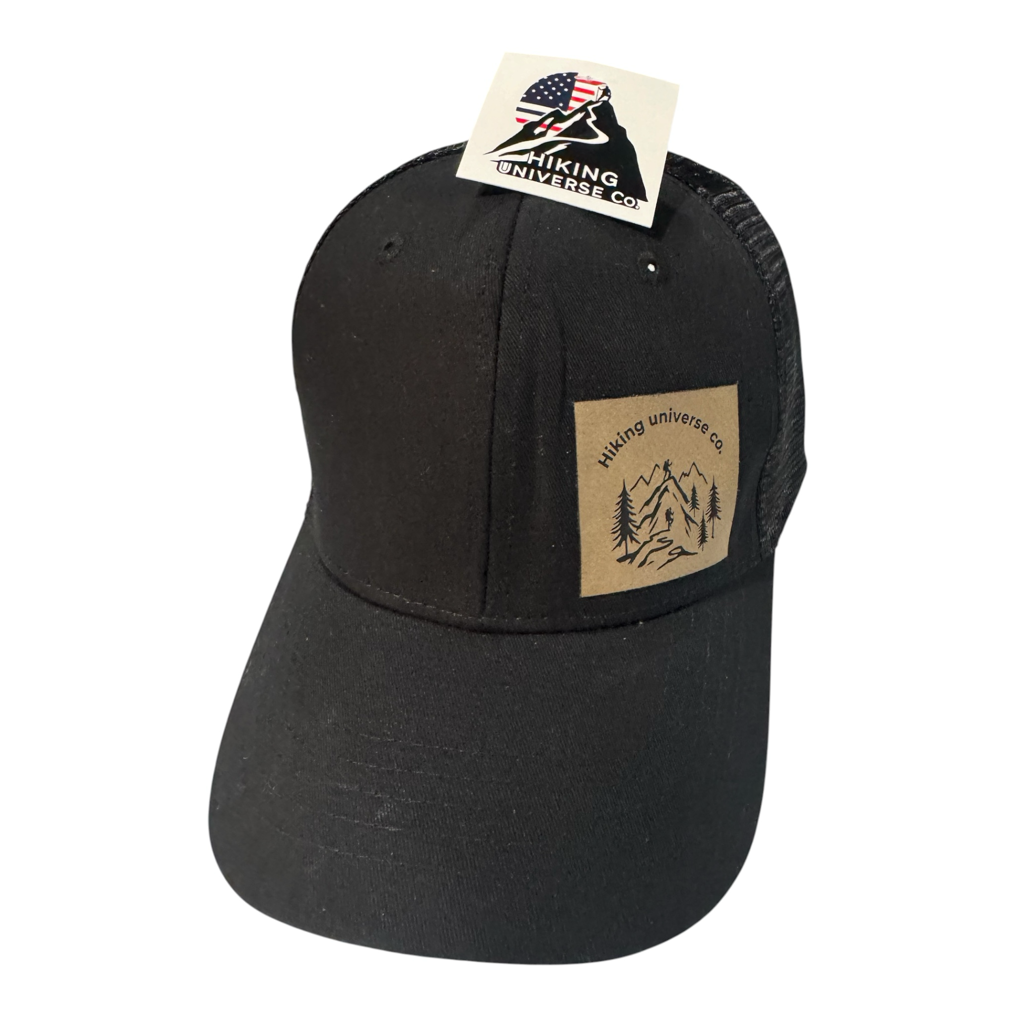 Hiking Universe Co. black trucker hat with mesh back and faux leather patch featuring mountain landscape.