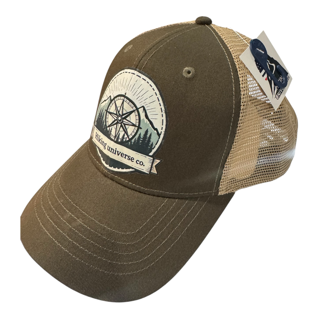 Hiking Universe Co. olive green trucker hat with tan mesh back and compass graphic patch. Adjustable snapback.