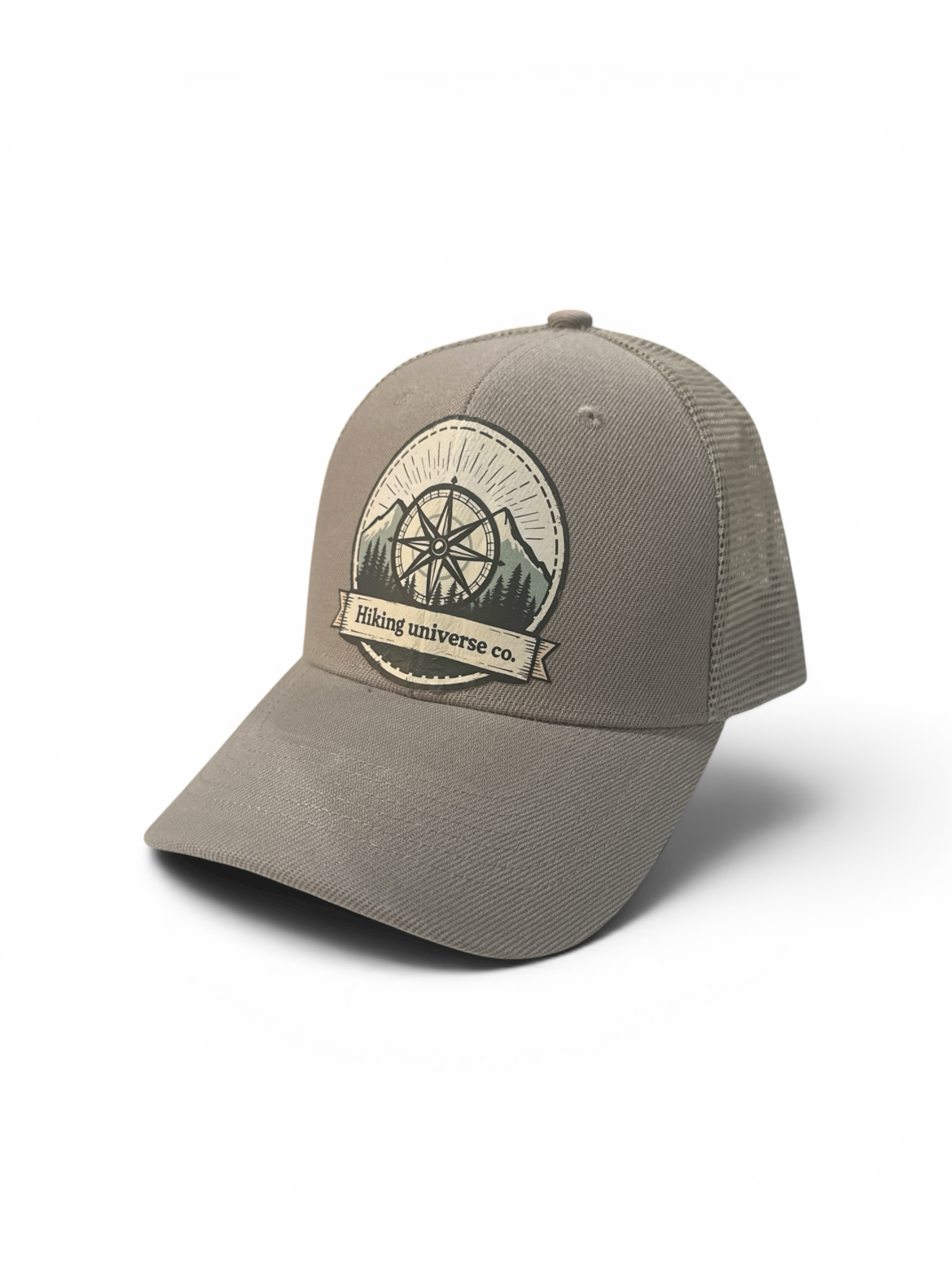 Hiking Universe Co. taupe cotton blend trucker hat with embroidered compass rose, mountains, and pine trees patch.