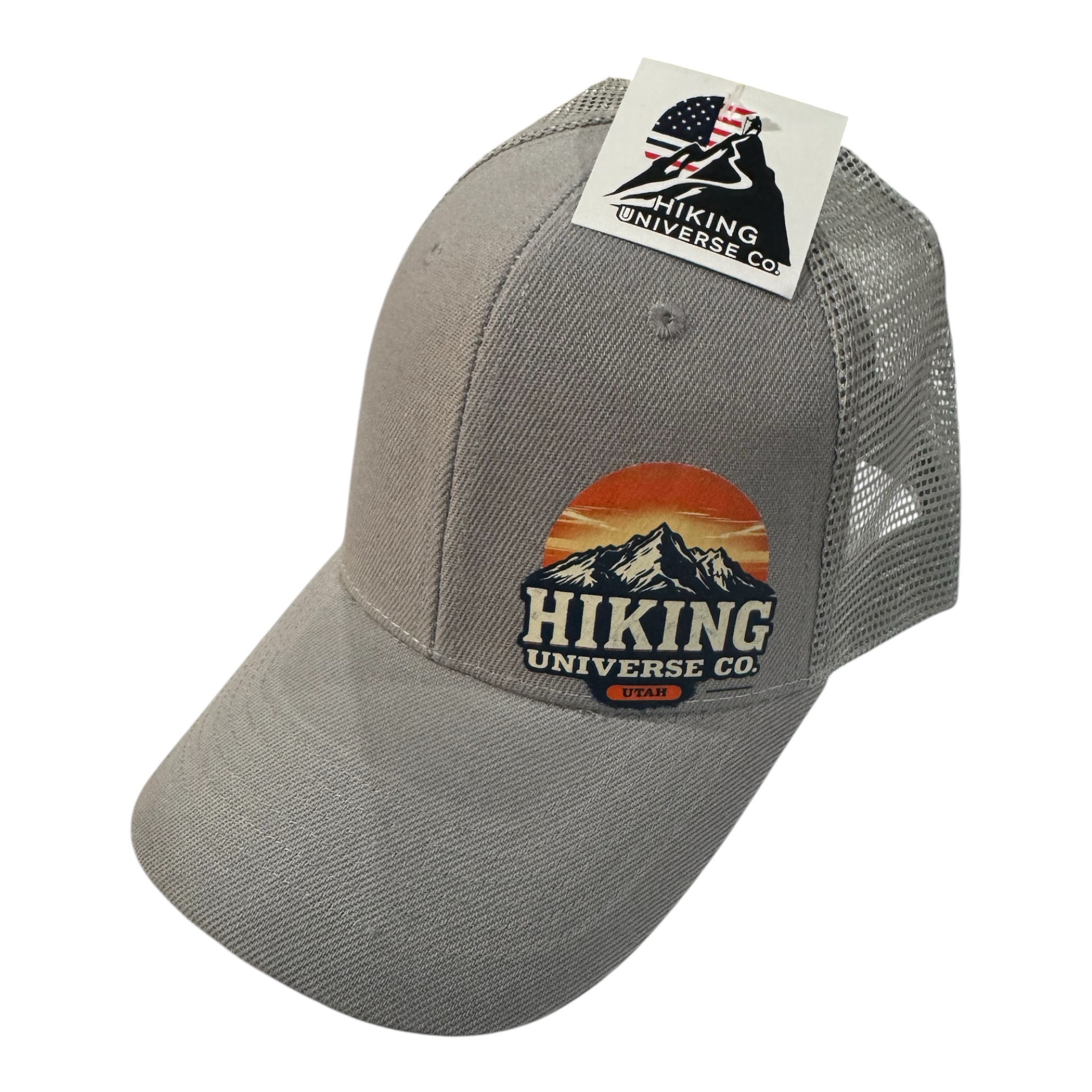 HIKING UNIVERSE CO. grey cotton blend trucker hat with mesh back and embroidered mountain sunset patch.