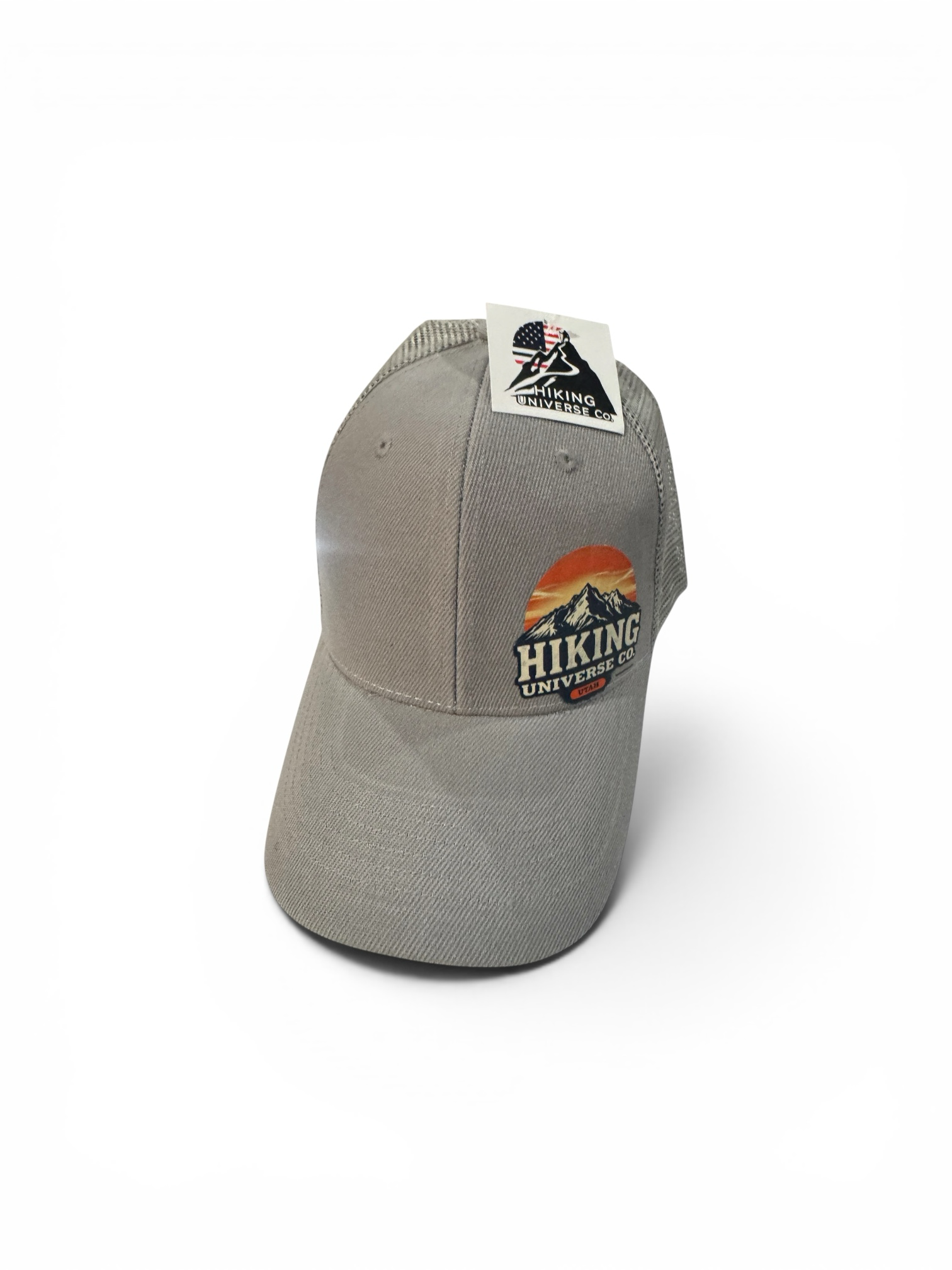 HIKING UNIVERSE CO. grey cotton blend trucker hat with mesh back and embroidered mountain sunset patch.