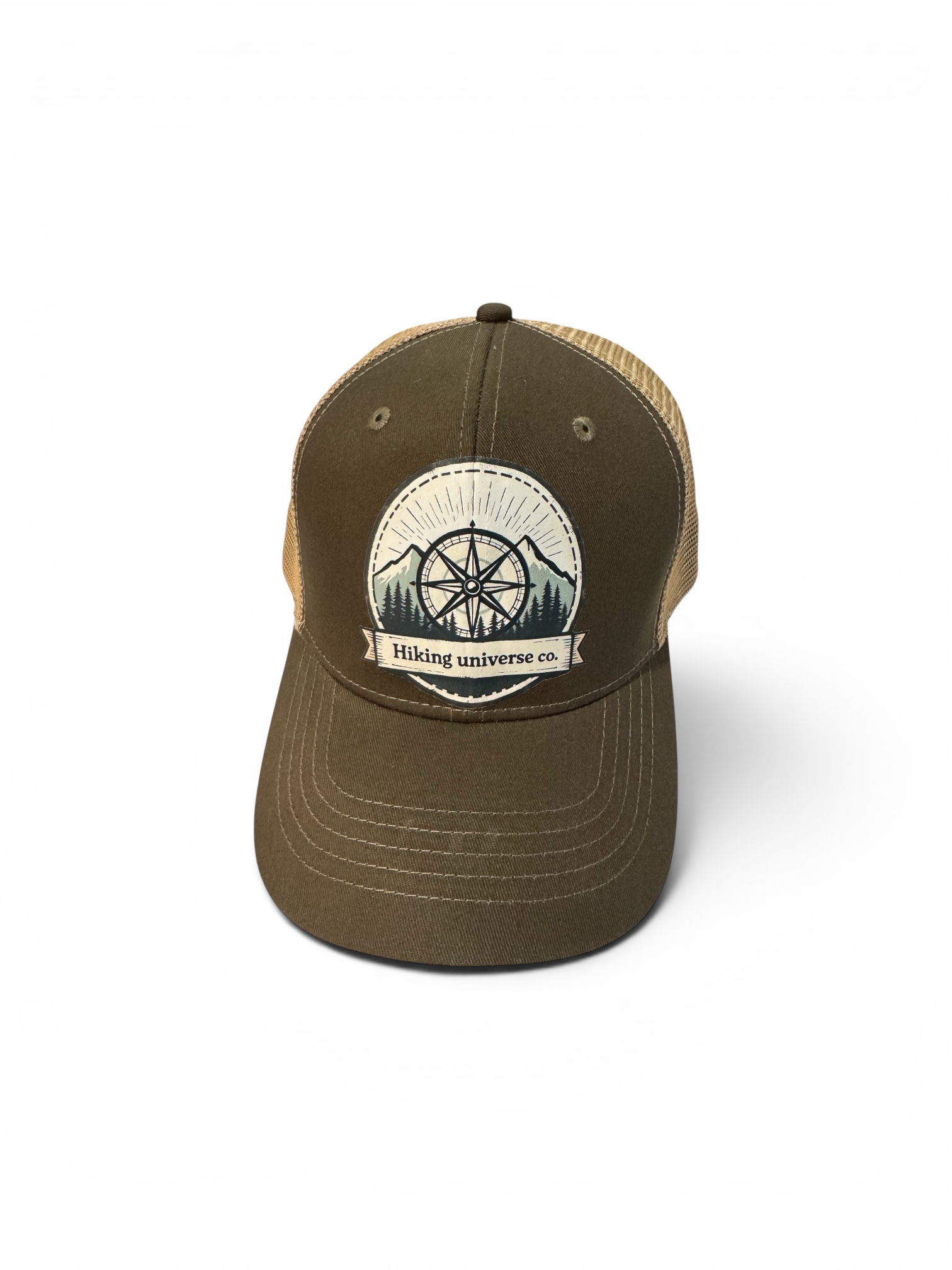 Hiking Universe Co. olive green cotton twill trucker hat with tan mesh back and embroidered compass graphic.