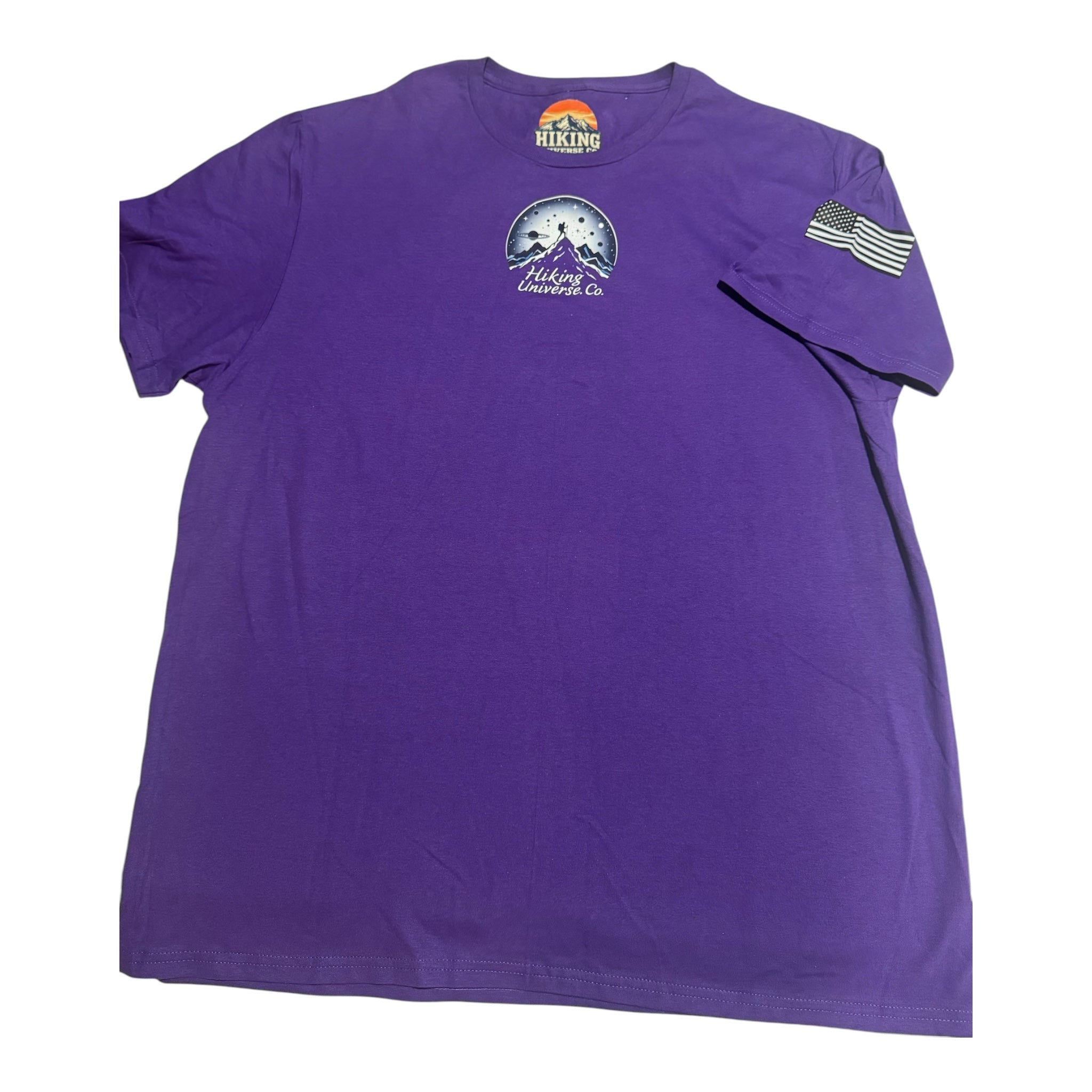 HIKING UNIVERSE CO. purple crewneck t-shirt featuring a mountain and celestial graphic on chest and flag sleeve detail.