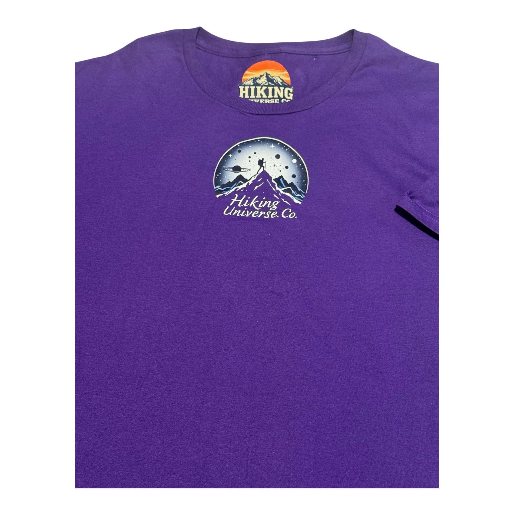 HIKING UNIVERSE CO. purple crewneck t-shirt featuring a mountain hiker and celestial graphic on the chest.